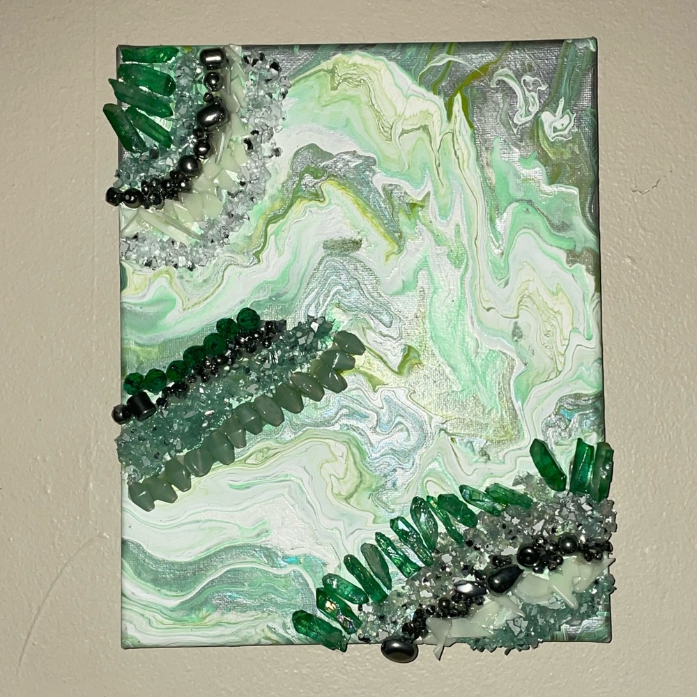 an 8x10 Glow in the dark Marble drip painting with colored Glass & Crystals .